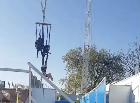 Woman Dangles from a ride at a fair in France after Signing a Waiver