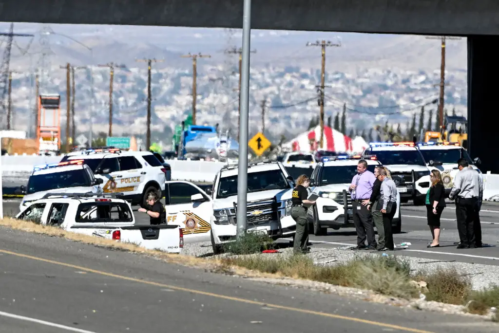 In Victorville, California, on September 27, 2022, police surround a car driven by Savannah Graziano's father, Anthony John Graziano, on the far left, after they exchange gunfire.