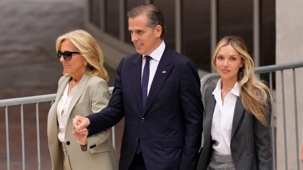 Hunter Biden holds hands with Jill Biden after felony conviction