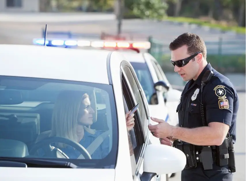 In this viral video, a police officer retaliates after a man laughs at him